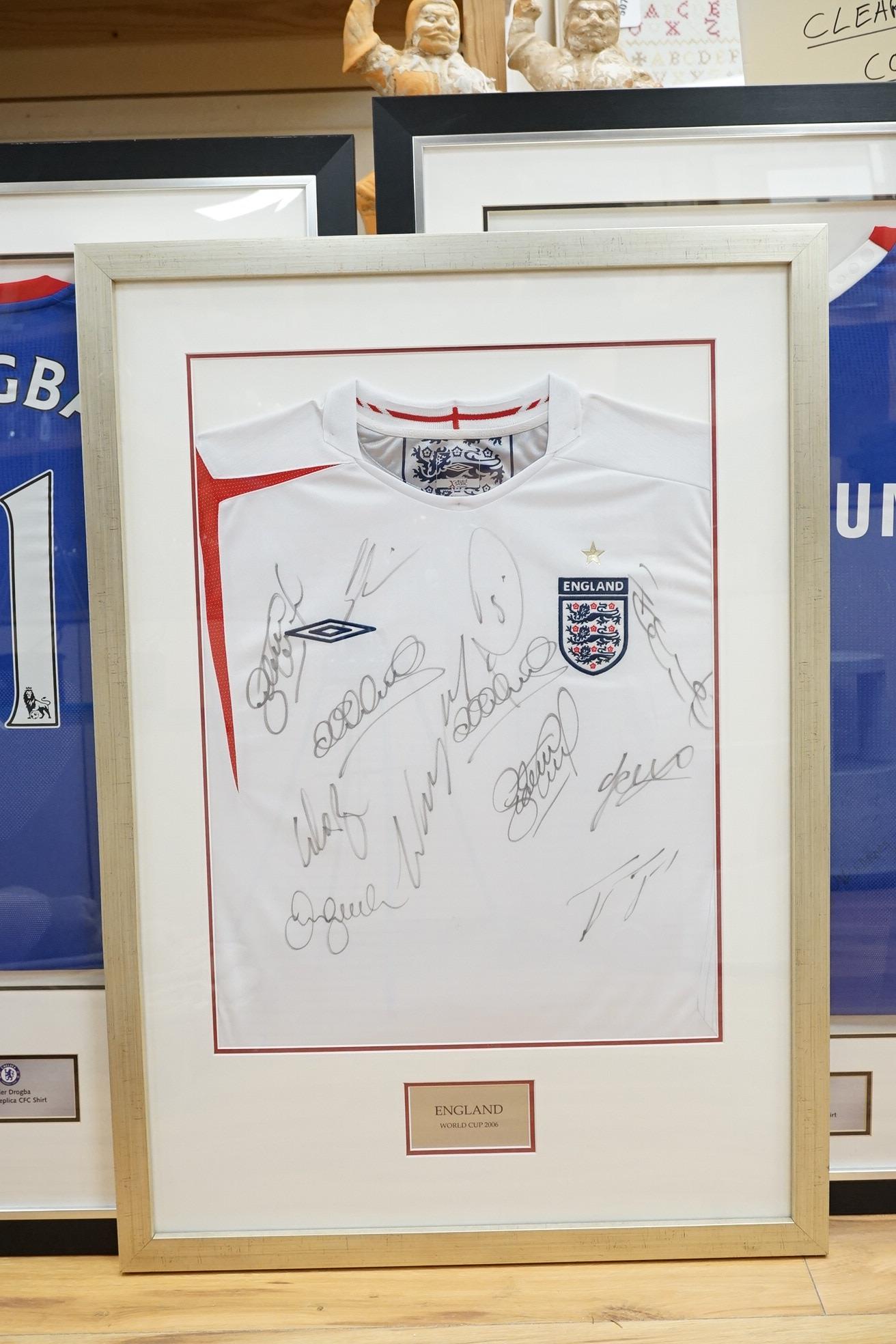 Three signed football shirts, to include England World Cup 2006 and Didier Drogba signed replica CFC shirt, framed. Condition - good